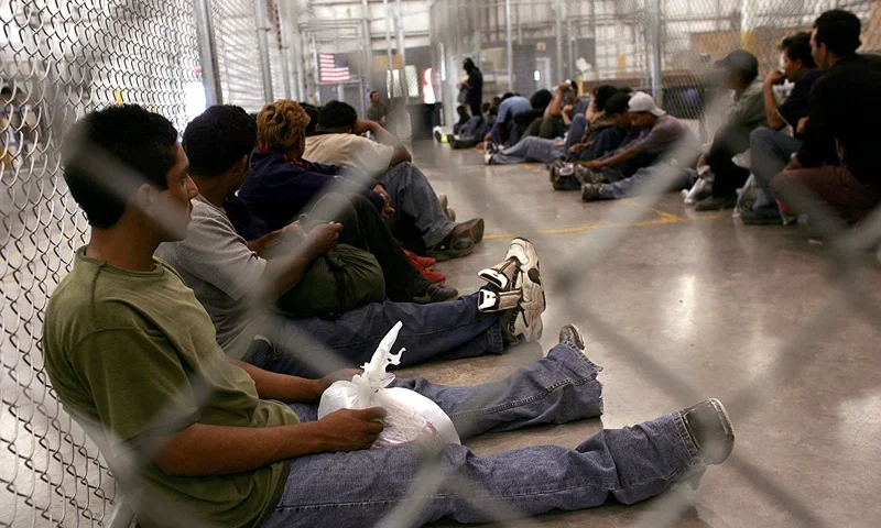 NOGALES, AZ - JUNE 21: Men who were caught crossing the U.S. border with Mexico illegally wait in a holding cell on June 21, 2006 at the U.S. Border Patrol processing center in Nogales, Arizona. U.S. President George W. Bush plans to deploy a total 6,000 National Guard soldiers in the four southern border states in an attempt to mitigate illegal immigration into America. Detentions along the U.S.-Mexico border decreased by 21 percent to 26,994, in the first 10 days of June according to U.S. authorities compared. (Photo by Spencer Platt/Getty Images)
