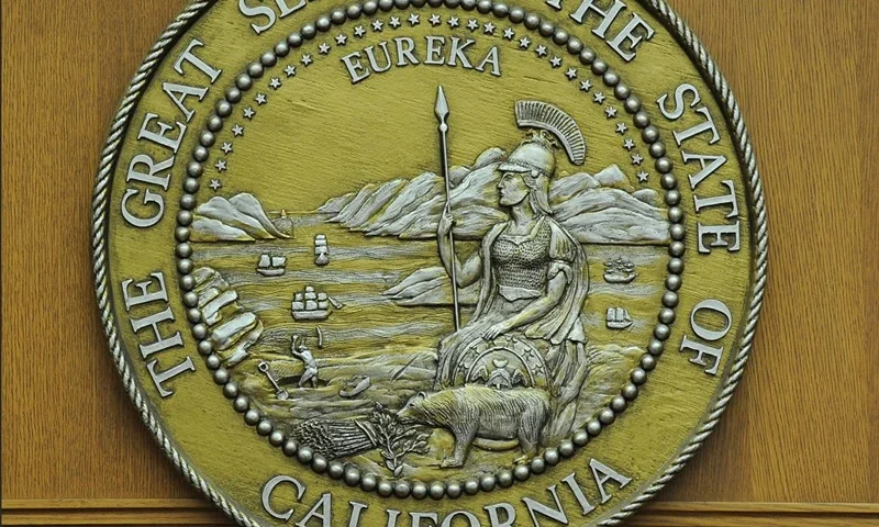 The seal of the state of California hangs in a closed courtroom at the Stanley Mosk Courthouse in downtown Los Angeles March 16, 2009. Beset by an unprecedented budget crisis, the LA Superior Court, the largest trial court system in the US, today laid of 329 employees and announced the closure of 17 courtrooms, with more of both expected in the future. AFP PHOTO / Robyn BECK (Photo credit should read ROBYN BECK/AFP via Getty Images)