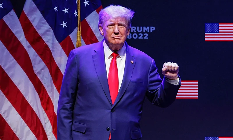 Former US President Donald Trump raises his fist as he arrives on stage to speak about education policy at the Adler Theatre in Davenport, Iowa on March 13, 2023. (Photo by KAMIL KRZACZYNSKI / AFP) (Photo by KAMIL KRZACZYNSKI/AFP via Getty Images)