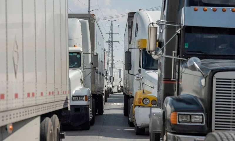 Semi-trucks wait for inspection before crossing the border at the Zaragoza International Bridge, in Juarez, Mexico, across the border from El Paso, Texas on May 31, 2019. - President Donald Trump escalated his abrupt tariff threats against Mexico, triggering alarm about the likely economic fallout, spooking global markets and raising the prospect of US trade wars on multiple fronts. Trump unexpectedly announced his readiness to levy tariffs on all Mexican imports, beginning at five percent starting June 10 and rising monthly to as high as 25 percent until Mexico substantially reduces the flow of illegal immigration. (Photo by Paul Ratje / AFP) (Photo credit should read PAUL RATJE/AFP via Getty Images)