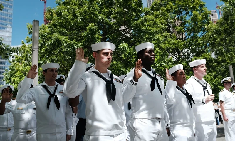 NEW YORK, NEW YORK - MAY 24: Members of the United States Navy participate in a re-enlistment and promotions ceremony at the September 11 Memorial on May 24, 2019 in New York City. Twenty sea service members participated in the ceremony which was held in conjunction with Fleet Week, the annual gathering of thousands of sailors and other service members in New York City. (Photo by Spencer Platt/Getty Images)