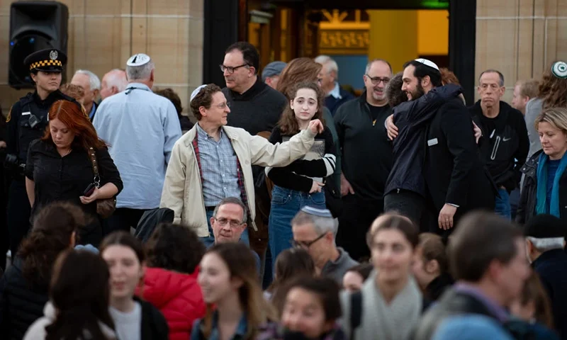 Attendees greet each other after public memorial service honoring the lives lost in the attack on the Tree of Life Synagogue on October 27, 2018 at the Soldiers and Sailors Memorial on October 27, 2019 in Pittsburgh, Pennsylvania. One year ago, Robert Bowers killed 11 people and wounded severa others during an attack of the Tree of Life synagogue. (Photo by Jeff Swensen/Getty Images)