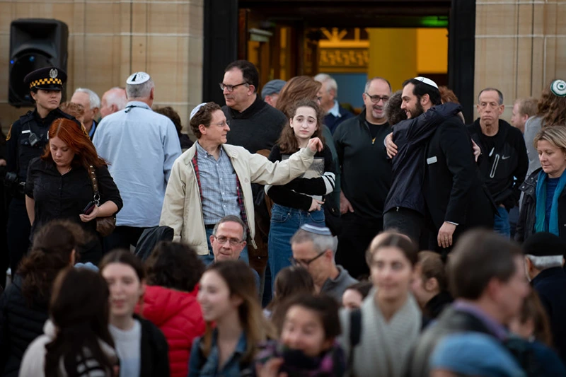 Attendees greet each other after public memorial service honoring the lives lost in the attack on the Tree of Life Synagogue on October 27, 2018 at the Soldiers and Sailors Memorial on October 27, 2019 in Pittsburgh, Pennsylvania. One year ago, Robert Bowers killed 11 people and wounded severa others during an attack of the Tree of Life synagogue. (Photo by Jeff Swensen/Getty Images)