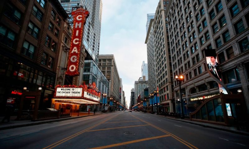 Chicago Theatre is seen in Chicago, Illinois, on March 21, 2020. - Almost one billion people were confined to their homes worldwide Saturday as the global coronavirus death toll topped 12,000 and US states rolled out stay-at-home measures already imposed across swathes of Europe. More than a third of Americans were adjusting to life in various phases of virtual lockdown -- including in the US's three biggest cities of New York, Los Angeles and Chicago -- with more states expected to ramp up restrictions. (Photo by KAMIL KRZACZYNSKI / AFP) (Photo by KAMIL KRZACZYNSKI/AFP via Getty Images)