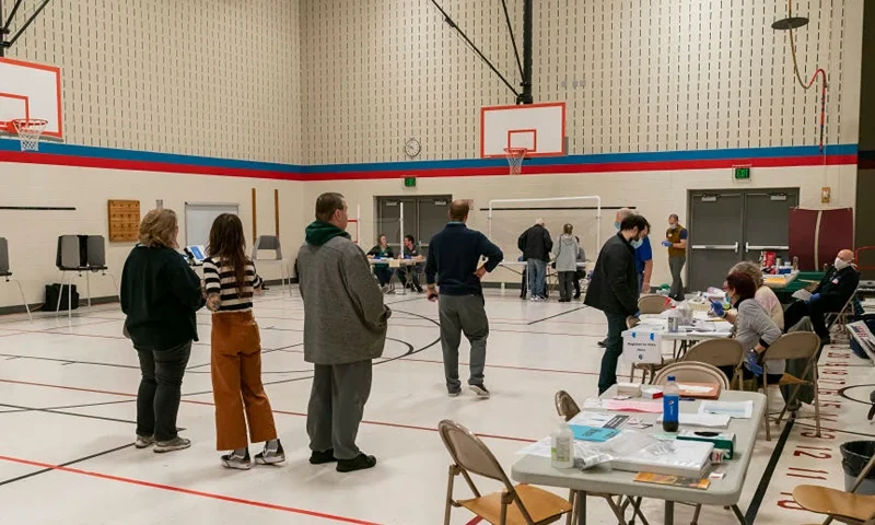 MADISON, WI - APRIL 07: People line up to vote at a polling place on April 7, 2020 in Madison, Wisconsin. Residents in Wisconsin went to the polls a day after the U.S. Supreme Court voted against an extension of the absentee ballot deadline in the state. Because of the coronavirus, the number of polling places was drastically reduced. (Photo by Andy Manis/Getty Images)