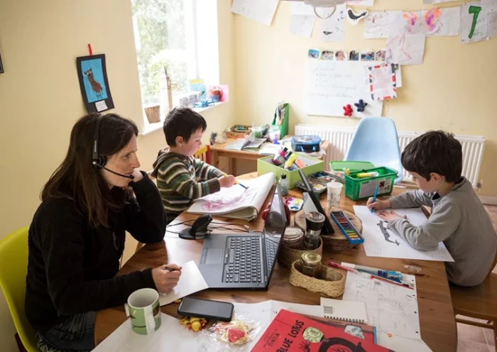 Six-year-old Leo (R) and his three-year old brother Espen (C) complete homeschooling activities suggested by the online learning website of their infant school, as his mother Moira, an employee of a regional council, works from home in the village of Marsden, near Huddersfield, northern England on May 15, 2020, during the novel coronavirus COVID-19 pandemic. Leo (R), aged 6, and Espen, aged 3, undertake homeschool activities suggested by the online learning website of their infant school whilst their mother Moira, a council employee, works from home in the village of Marsden, near Huddersfield, northern England on May 15, 2020. - Prime Minister Boris Johnson has urged millions unable to work from home to return to their jobs under the new guidelines, which do not apply in Scotland, Wales or Northern Ireland. (Photo by OLI SCARFF / AFP) (Photo by OLI SCARFF/AFP via Getty Images)