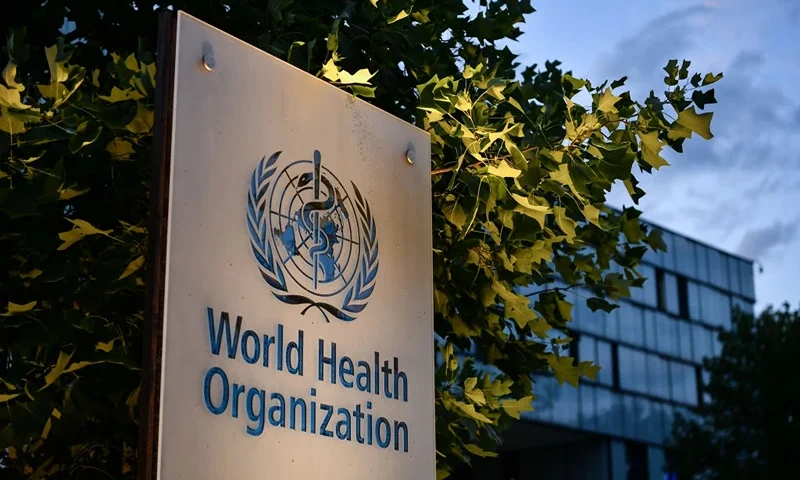 A photo taken in the late hours of August 17, 2020 shows a sign of the World Health Organization (WHO) at their headquarters in Geneva amid the COVID-19 outbreak, caused by the novel coronavirus. (Photo by Fabrice COFFRINI / AFP) (Photo by FABRICE COFFRINI/AFP via Getty Images)