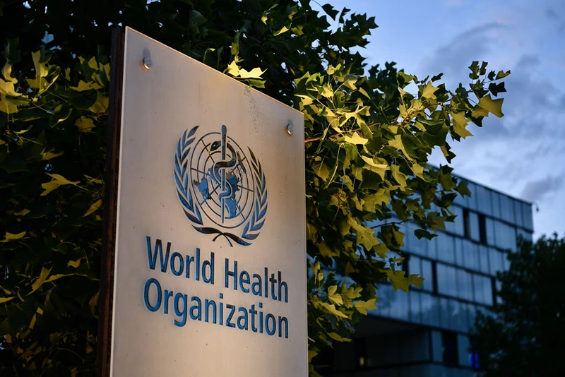A photo taken in the late hours of August 17, 2020 shows a sign of the World Health Organization (WHO) at their headquarters in Geneva amid the COVID-19 outbreak, caused by the novel coronavirus. (Photo by Fabrice COFFRINI / AFP) (Photo by FABRICE COFFRINI/AFP via Getty Images)