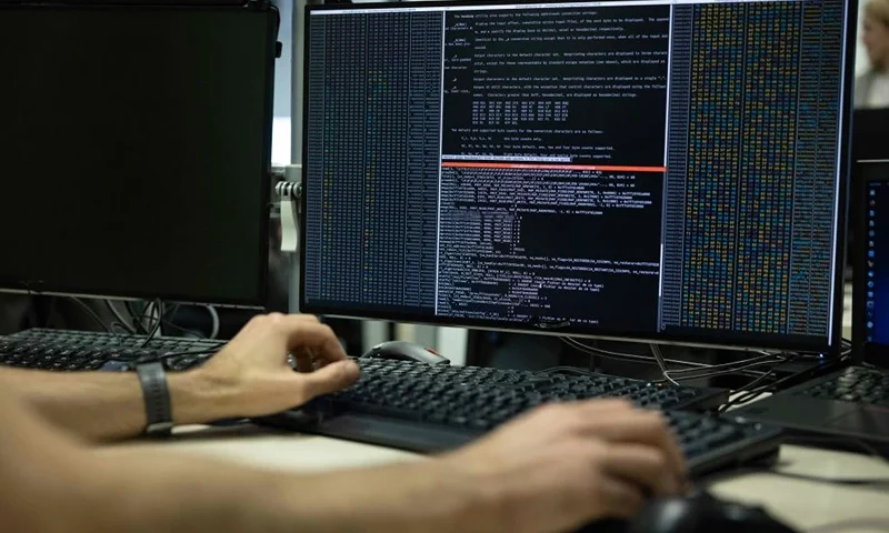 An agent of the operational center of the French National Cybersecurity Agency (ANSSI) checks datas on a computer in Paris on November 24, 2022. (Photo by Thomas SAMSON / AFP) (Photo by THOMAS SAMSON/AFP via Getty Images)