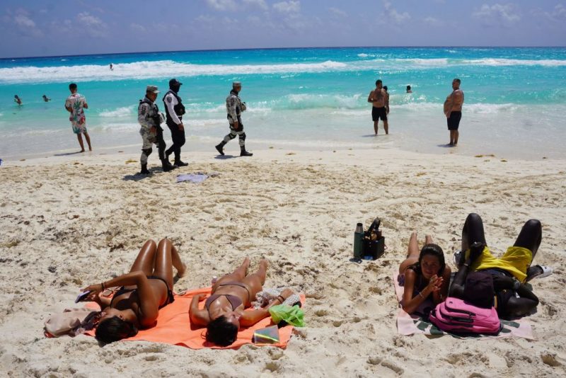 Members of the Mexican Navy and National Guard patrol the tourist beach area of Cancun, Quintana Roo state, Mexico on March 18, 2023. - US students on spring break, known as 