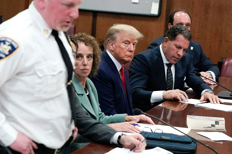 Former US president Donald Trump appears in court at the Manhattan Criminal Court in New York on April 4, 2023. - Former US president Donald Trump arrived for a historic court appearance in New York on Tuesday, facing criminal charges that threaten to upend the 2024 White House race. (Photo by Seth WENIG / POOL / AFP) (Photo by SETH WENIG/POOL/AFP via Getty Images)