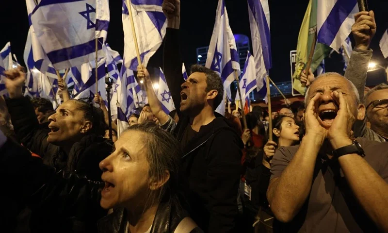Protesters take part in ongoing demonstrations against the government's judicial reform bill in Tel Aviv on April 8, 2023. (Photo by GIL COHEN-MAGEN / AFP) (Photo by GIL COHEN-MAGEN/AFP via Getty Images)