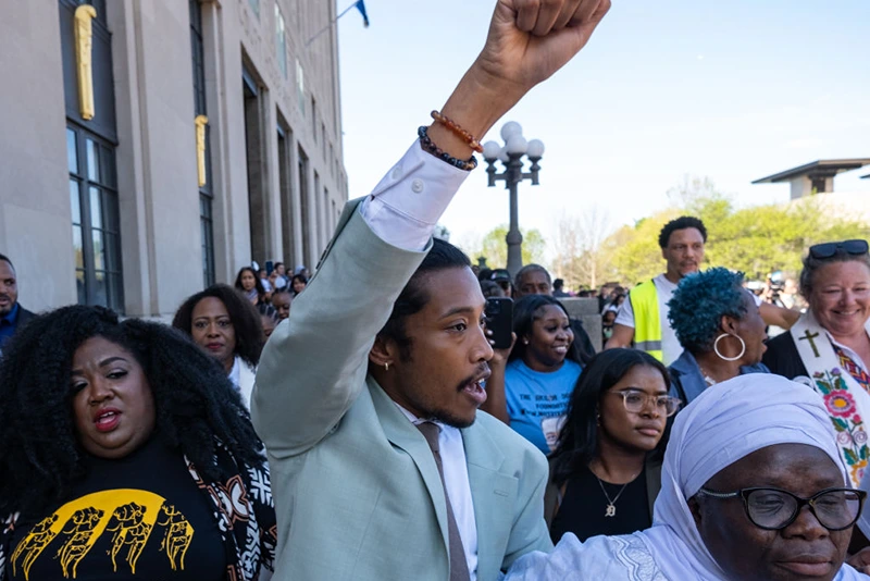 State Rep. Justin Jones of Nashville raises his fist after being reinstated to his seat on April 10, 2023 in Nashville, Tennessee. The move comes days after the Democrat was expelled for leading a protest on the House floor for gun reform in the wake of a mass shooting at a Christian school in which three 9-year-old students and three adults were killed by a 28-year-old former student on March 27. (Photo by Seth Herald/Getty Images)
