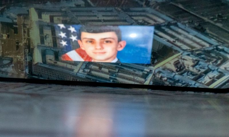 This photo illustration created on April 13, 2023, shows the suspect, national guardsman Jack Teixeira, reflected in an image of the Pentagon in Washington, DC. - FBI agents on Thursday arrested a young national guardsman suspected of being behind a major leak of sensitive US government secrets -- including about the Ukraine war. US Attorney General Merrick Garland announced the arrest made "in connection with an investigation into alleged unauthorized removal, retention and transmission of classified national defense information." (Photo by Stefani REYNOLDS / AFP) (Photo by STEFANI REYNOLDS/AFP via Getty Images)