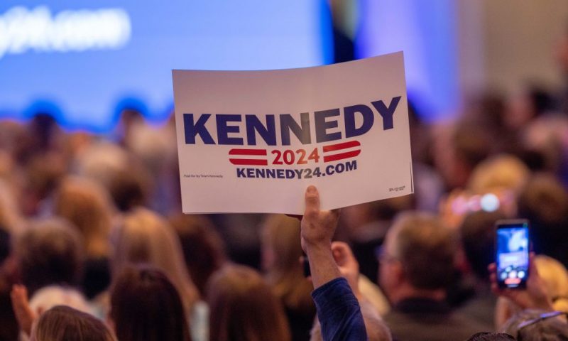 BOSTON, MA - APRIL 19: A supporter holds up a sign for Robert F. Kennedy Jr. during his official announcement that he is running for President on April 19, 2023 in Boston, Massachusetts. An outspoken anti-vaccine activist, RFK Jr. joins self-help author Marianne Williamson in the Democratic presidential field of challengers for 2024. (Photo by Scott Eisen/Getty Images)