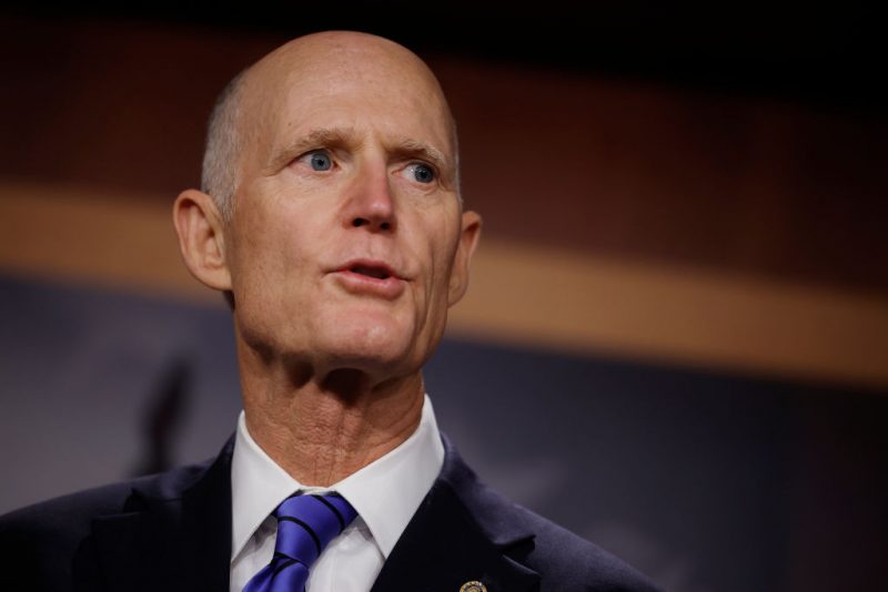 Sen. Sen. Rick Scott (R-FL) talk to reporters about the federal debt limit during a news conference with members of the House Freedom Caucus at the U.S. Capitol on March 22, 2023 in Washington, DC. The conservative Republicans were critical of President Joe Biden's federal budget proposal and repeated their slogan, 