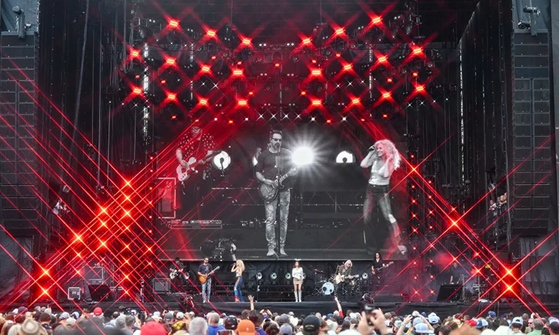 HOUSTON, TEXAS - APRIL 02: (EDITOR’S NOTE: Image was created using a star filter) (L-R) Jimi Westbrook, Kimberly Schlapman, Karen Fairchild and Philip Sweet of Little Big Town perform onstage during the Capital One JamFest during the NCAA March Madness Music Festival at Discovery Green on April 02, 2023 in Houston, Texas. (Photo by Derek White/Getty Images for Warner Bros. Discovery Sports)