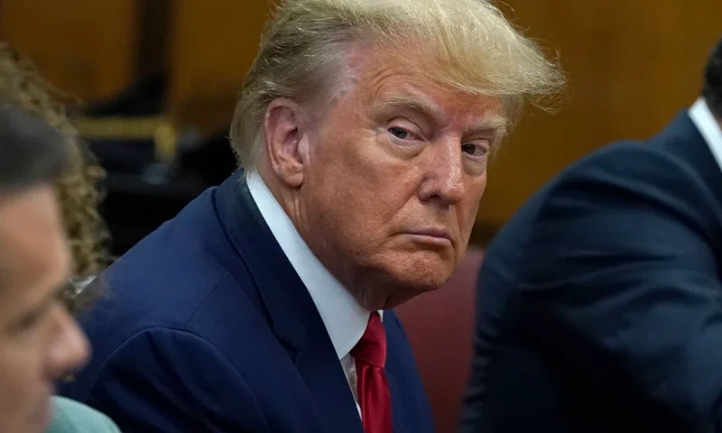 NEW YORK, NY - APRIL 04: Former U.S. President Donald Trump sits with his attorneys inside the courtroom during his arraignment at the Manhattan Criminal Court April 4, 2023 in New York City. Trump pleaded not guilty to 34 felony counts stemming from hush money payments made to adult film star Stormy Daniels before the 2016 presidential election. With his indictment, Trump will become the first former U.S. president in history to be charged with a criminal offense. (Photo by Timothy A. Clary-Pool/Getty Images)