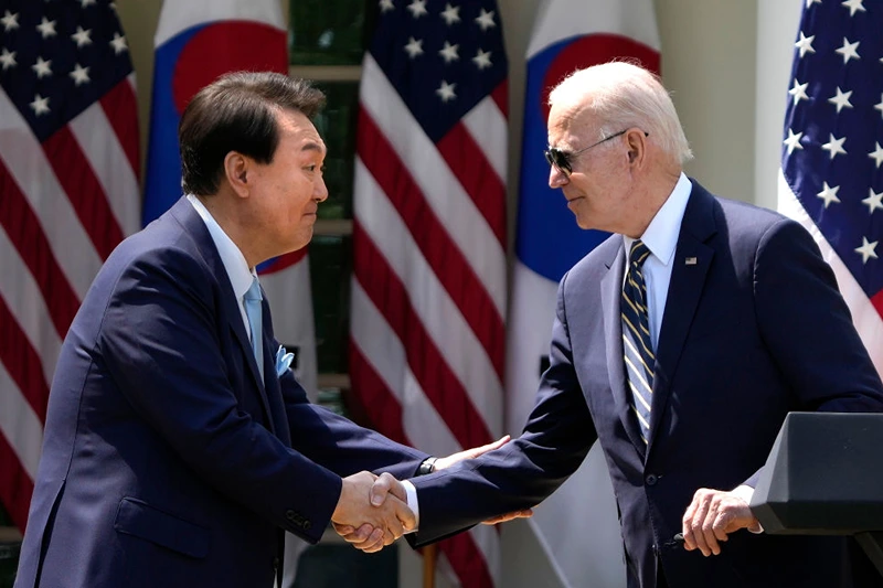WASHINGTON, DC - APRIL 26: U.S. President Joe Biden (R) and South Korean President Yoon Suk-yeol shake hands during a joint press conference in the Rose Garden at the White House, April 26, 2023 in Washington, DC. President Biden is hosting President Yoon on his first visit to the United States as the two nations have reached a nuclear weapons agreement. (Photo by Drew Angerer/Getty Images)
