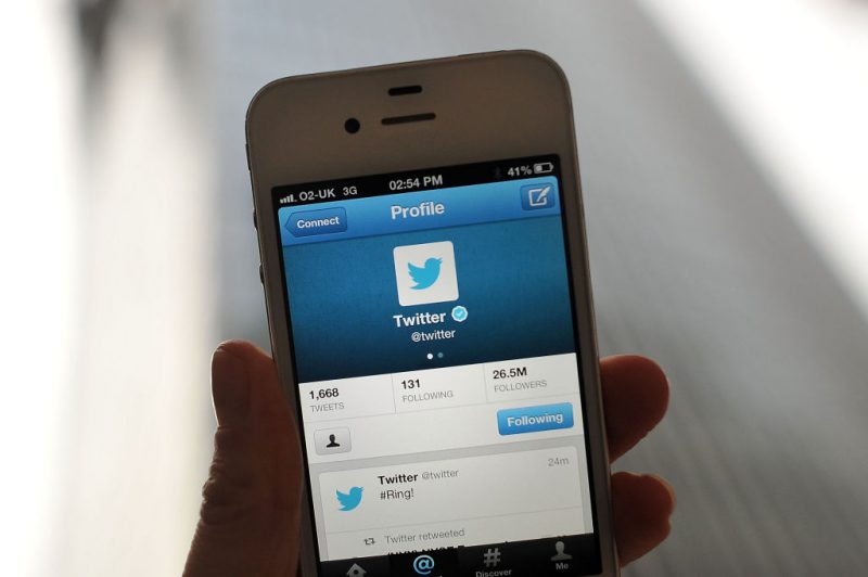 In this photo illustration, the Twitter logo and hashtag '#Ring!' is displayed on a mobile device as the company announced its initial public offering and debut on the New York Stock Exchange on November 7, 2013 in London, England. Twitter went public on the NYSE opening at USD 26 per share, valuing the company's worth at an estimated USD 18 billion. (Photo by Bethany Clarke/Getty Images)