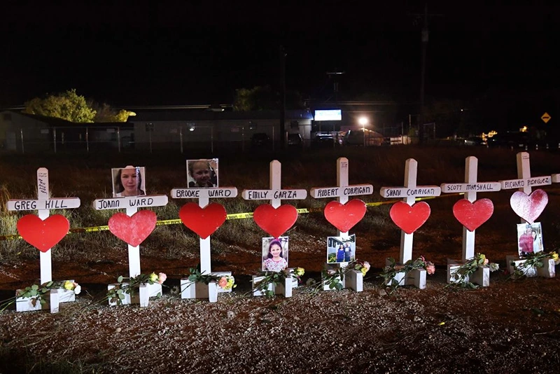 Crosses with the names of victims are seen outside the First Baptist Church which was the scene of the mass shooting that killed 26 people in Sutherland Springs, Texas on November 8, 2017. Willeford shot suspect Devin Patrick Kelley, a gunman wearing all black armed with an assault rifle that opened fire on a small-town Texas church during Sunday morning services, on November 5, killing 26 people and wounding 20 more in the last mass shooting to shock the United States. / AFP PHOTO / MARK RALSTON (Photo credit should read MARK RALSTON/AFP via Getty Images)