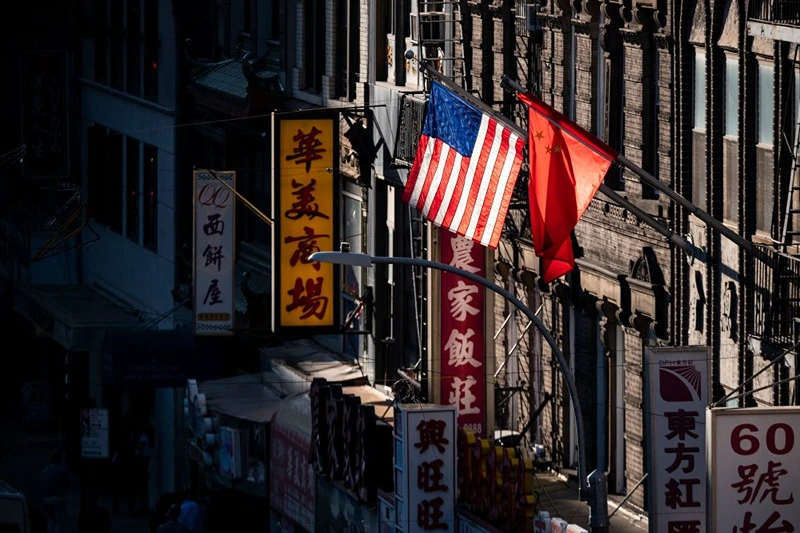 A U.S. and Chinese flag are seen in Chinatown on October 14, 2019 in New York City. (Photo by Johannes EISELE / AFP) (Photo by JOHANNES EISELE/AFP via Getty Images)