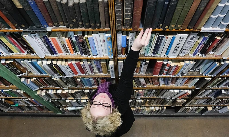 LEEDS, ENGLAND - JANUARY 09: Assistant Librarian Anna Goodridge straightens bookshelves inside the Leeds Library on January 9, 2018 in Leeds, England. This year sees the 250th anniversary of the oldest subscription library in the United Kingdom. Founded in 1768 the Grade II listed building in the heart of Leeds is the the oldest surviving example of this sort of library in the country. It holds over 140,000 thousand books and has 880 members. To mark the anniversary there are a range of events planned throughout the year. (Photo by Ian Forsyth/Getty Images)