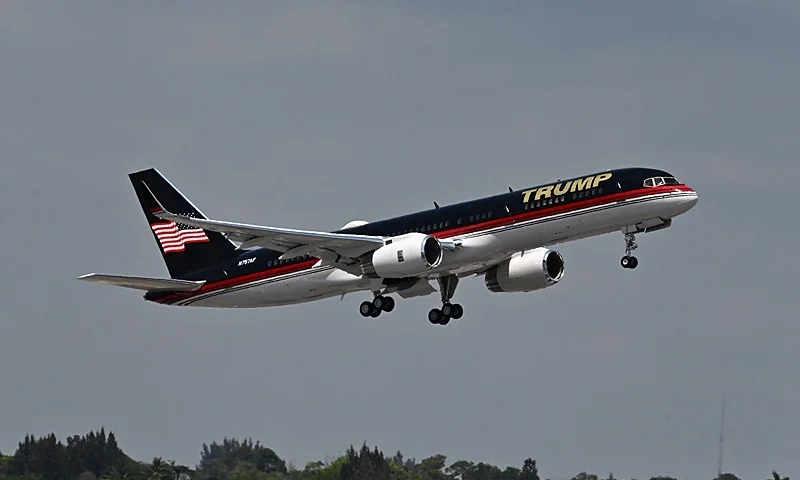 The plane of former US president Donald Trump takes off from Palm Beach International Airport in West Palm Beach, Florida, on April 3, 2023. - Former US President Donald Trump is to be booked, fingerprinted, and will have a mugshot taken at a Manhattan courthouse on the afternoon of April 4, 2023, before appearing before a judge as the first ever American president to face criminal charges. (Photo by CHANDAN KHANNA/AFP via Getty Images)