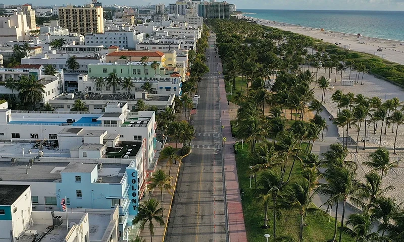 MIAMI BEACH, FLORIDA - MARCH 24: In this aerial view from a drone, desolate Ocean Drive is seen after most visitors have checked out of their hotels in a citywide effort to contain the coronavirus on March 24, 2020 in Miami Beach, Florida. Miami Beach ordered its hotels closed to visitors in an effort to slow the spread of COVID-19. (Photo by Joe Raedle/Getty Images)