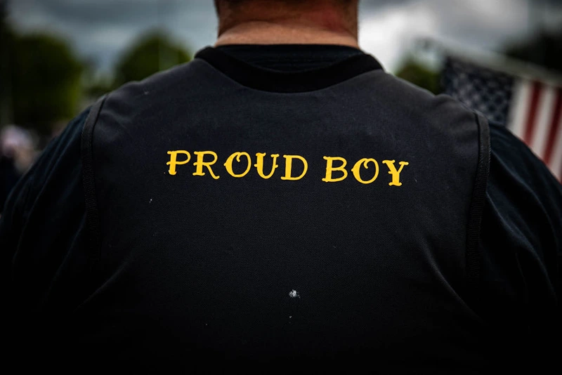 A man wears a Proud Boy vest as several hundred members of the Proud Boys and other similar groups gathered at Delta Park in Portland, Oregon on September 26, 2020. - Far-right group "Proud Boys" members gather in Portland to show support to US President Donald Trump and to condemn the violence that has been occurring for more than three months during "Black Lives Matter" and "Antifa" protests. (Photo by Maranie R. STAAB / AFP) (Photo by MARANIE R. STAAB/AFP via Getty Images)