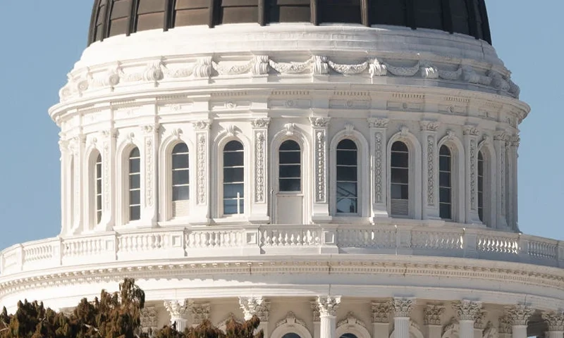 Members of the National Guard keep watch from atop a balcony at the State Capitol in Sacramento, California on January 17, 2021 during a nationwide protest called by anti-government and far-right groups supporting US President Donald Trump and his claim of electoral fraud in the November 3 presidential election. - The FBI warned authorities in all 50 states to prepare for armed protests at state capitals in the days leading up to the January 20 presidential inauguration of President-elect Joe Biden. (Photo by JOSH EDELSON / AFP) (Photo by JOSH EDELSON/AFP via Getty Images)