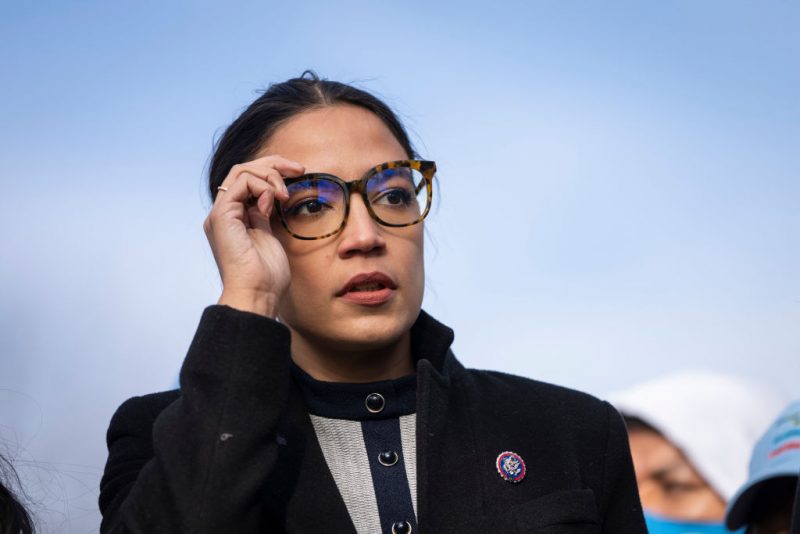 Rep. Alexandria Ocasio-Cortez (D-NY) prepares to speak during a rally for immigration provisions to be included in the Build Back Better Act outside the U.S. Capitol December 7, 2021 in Washington, DC. Progressive Democrats are urging the Senate to include a pathway to citizenship for undocumented immigrants living in the U.S. in the Build Back Better Act. (Photo by Drew Angerer/Getty Images)