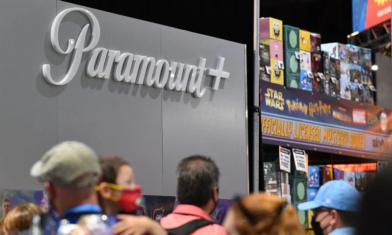 Attendees walk by the booth for the Paramount+ streaming service during San Diego Comic-Con International in San Diego, California, on July 24, 2022. (Photo by Chris Delmas / AFP) (Photo by CHRIS DELMAS/AFP via Getty Images)