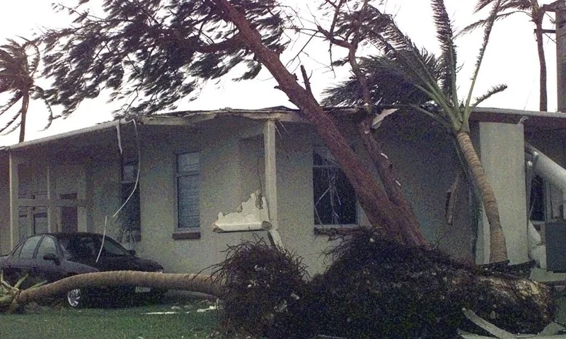Trees uprooted by Typhoon Paka caused extensive damage to this housing unit on Naval Base Marianas, in Guam, 18 December. The typhoon hit the island 16 December with average sustained winds of 175 mph. One wind gust of 236 mph was recorded at Anderson Air Force Base as the strongest ever recorded on earth. Most of the island's residents were left without power and water. Guam's Gov. Carl Gutierrez estimates the damage at over $200 million. AFP PHOTO/US Navy/Alan KINIRY (Photo by ALAN KINIRY / NAVY NEWS PHOTO PENTAGON / AFP) (Photo by ALAN KINIRY/NAVY NEWS PHOTO PENTAGON/AFP via Getty Images)