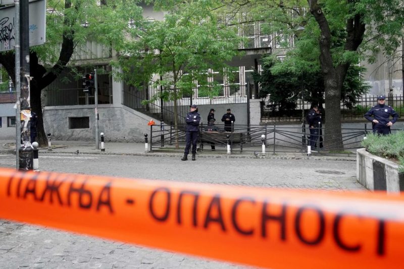 Police officers guard the school entrance following a shooting at a school in the capital Belgrade on May 3, 2023. - Serbian police arrested a student following a shooting at an elementary school in the capital Belgrade on May 3, 2023, the interior ministry said. The shooting occurred at 8:40 am local time (06:40 GMT) at an elementary school in Belgrade's downtown Vracar district. (Photo by Oliver Bunic / AFP) (Photo by OLIVER BUNIC/AFP via Getty Images)