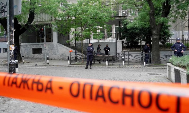 Police officers guard the school entrance following a shooting at a school in the capital Belgrade on May 3, 2023. - Serbian police arrested a student following a shooting at an elementary school in the capital Belgrade on May 3, 2023, the interior ministry said. The shooting occurred at 8:40 am local time (06:40 GMT) at an elementary school in Belgrade's downtown Vracar district. (Photo by Oliver Bunic / AFP) (Photo by OLIVER BUNIC/AFP via Getty Images)