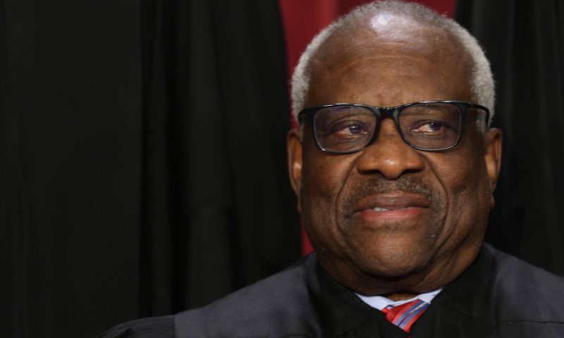 United States Supreme Court Associate Justice Clarence Thomas poses for an official portrait at the East Conference Room of the Supreme Court building on October 7, 2022 in Washington, DC. The Supreme Court has begun a new term after Associate Justice Ketanji Brown Jackson was officially added to the bench in September. (Photo by Alex Wong/Getty Images)