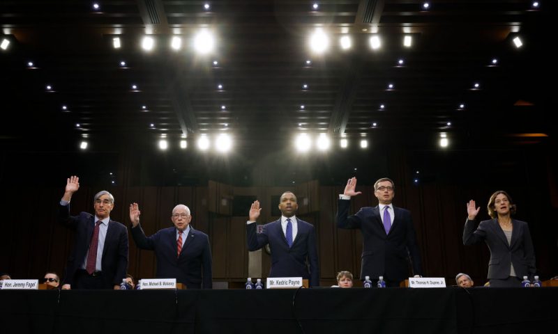 WASHINGTON, DC - MAY 02: (L-R) Former U.S. District Judge for the Northern District of California Jeremy Fogel, former U.S. Attorney General Michael Mukasey, Campaign Legal Center Director of Ethics Kendric Payne, attorney Thomas Dupree Jr. and University of Virginia School of Law Professor Amanda Frost are sworn in during a Senate Judiciary Committee hearing in the Hart Senate Office Building on Capitol Hill on May 02, 2023 in Washington, DC. Chief Justice John G. Roberts Jr. was invited but declined to testify before the committee, which is holding the hearing after a recent ProPublica investigation revealed that Thomas had accepted numerous luxury vacations for years from a billionaire Texas Republican real estate developer and, in a separate matter, Associate Justice Neil Gorsuch did not reveal that a property he sold in Colorado was purchased by an executive at a law firm that frequently has business before the court. (Photo by Chip Somodevilla/Getty Images)