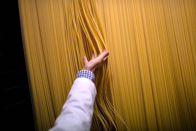 CALDES DE MONTBUI, SPAIN - OCTOBER 27: Carles Sanmarti checks noodles drying in wood cabinets at Pasta Sanmarti factory on October 27, 2015 in Caldes de Montbui, Spain. The Sanmarti family has been involved in the production of pasta since 1700. Carles Sanmarti, the 8th generation descendent, still uses the original recipe using just amber durum wheat semolina, thermal mineral water and egg free. Sanmarti nowadays exports their pasta products to countries as diverse as the United States, China, Denmark and also to the United Kingdom, their largest foreign market. (Photo by David Ramos/Getty Images)
