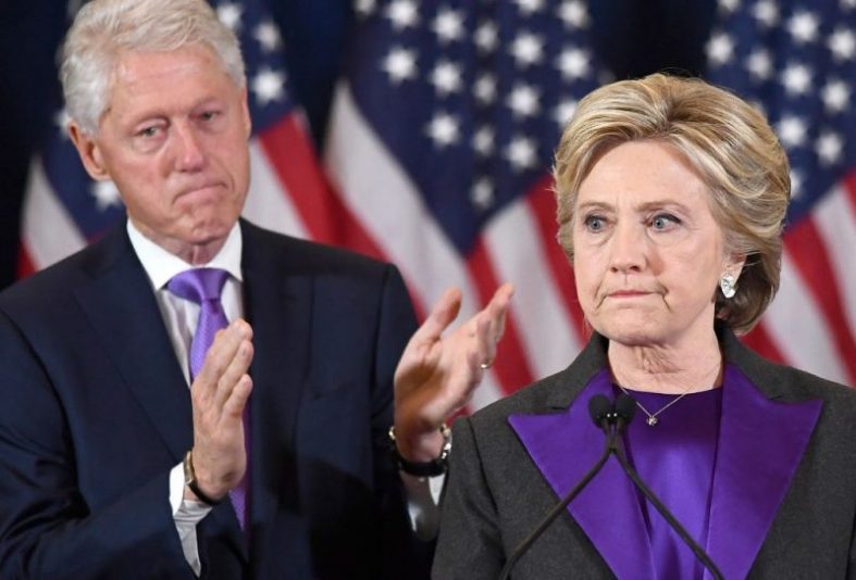 TOPSHOT - US Democratic presidential candidate Hillary Clinton makes a concession speech after being defeated by Republican President-elect Donald Trump, as former President Bill Clinton looks on in New York on November 9, 2016. / AFP PHOTO / JEWEL SAMAD (Photo credit should read JEWEL SAMAD/AFP via Getty Images)