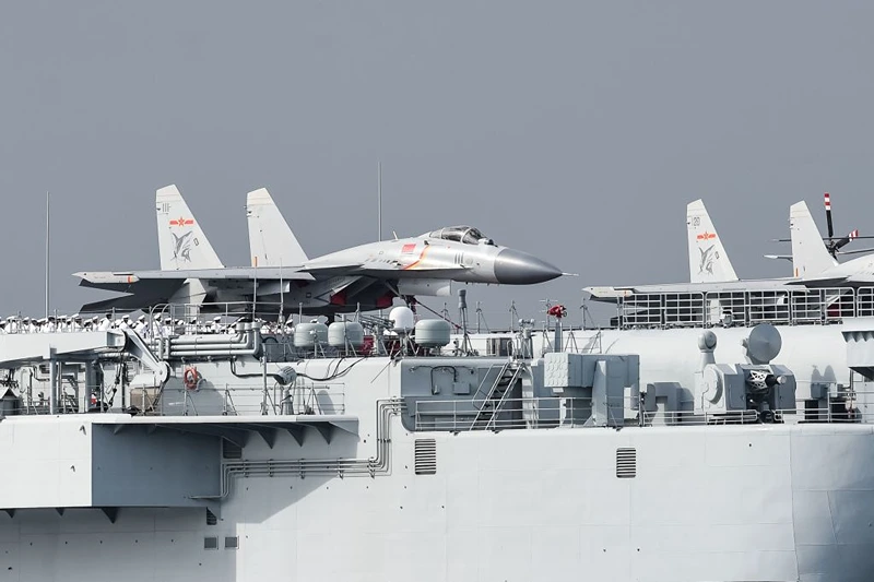J-15 fighter jets are seen on the flight deck of China's sole aircraft carrier, the Liaoning, as it arrives in Hong Kong waters. (Photo credit should read ANTHONY WALLACE/AFP via Getty Images)