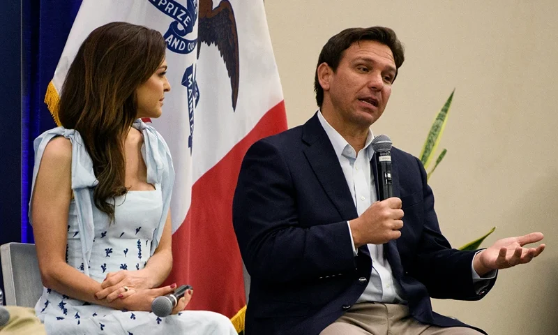 CEDAR RAPIDS, IOWA - MAY 13: Florida Gov. Ron DeSantis (R) speaks onstage with his wife, Casey DeSantis (C) during an Iowa GOP reception on May 13, 2023 in Cedar Rapids, Iowa. Although he has not yet announced his candidacy, Gov. DeSantis has received the endorsement of 37 Iowa lawmakers for the Republican presidential nomination next year. (Photo by Stephen Maturen/Getty Images)