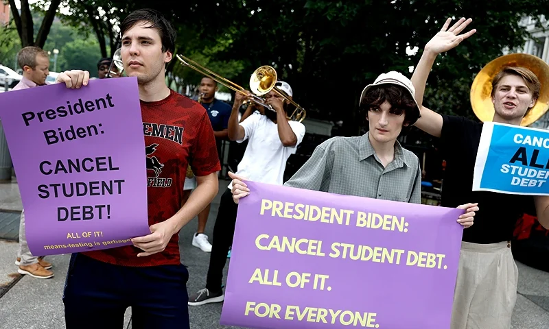WASHINGTON, DC - JULY 27: Activists attend a rally outside of the White House to call on U.S. President Joe Biden to cancel student debt on July 27, 2022 in Washington, DC. Student loan borrowers are awaiting a decision from President Biden on student loan payments. (Photo by Anna Moneymaker/Getty Images)