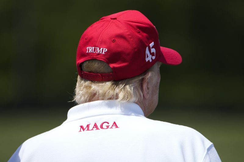 Former President Donald Trump watches golfers on the driving range before the second round of the LIV Golf at Trump National Golf Club, Saturday, May 27, 2023, in Sterling, Va. (AP Photo/Alex Brandon)