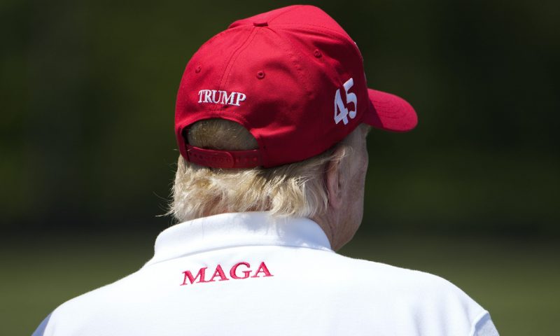 Former President Donald Trump watches golfers on the driving range before the second round of the LIV Golf at Trump National Golf Club, Saturday, May 27, 2023, in Sterling, Va. (AP Photo/Alex Brandon)