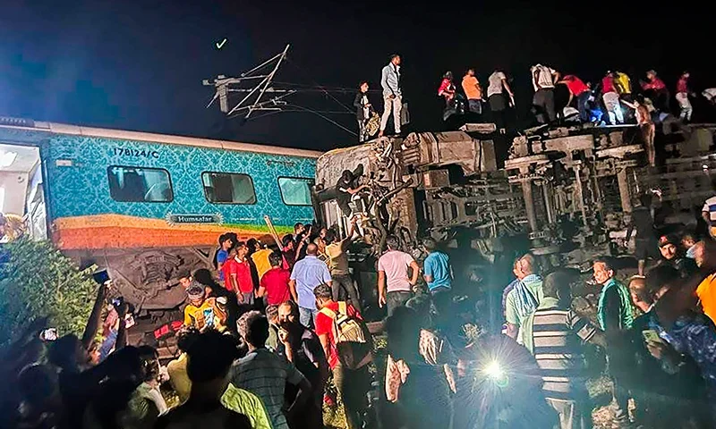 Rescuers work at the site of passenger trains that derailed in Balasore district, in the eastern Indian state of Orissa, Friday, June 2, 2023. Two passenger trains derailed in India, killing at least 13 people and trapping hundreds of others inside more than a dozen damaged coaches, officials said. About 400 people were injured and taken to hospitals, and the cause of the accident was under investigation, officials said. (Press Trust of India via AP)