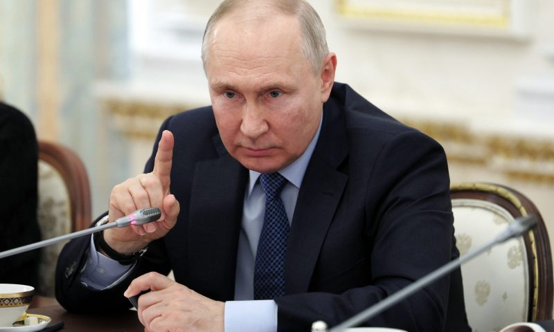Russian President Vladimir Putin gestures as he speaks during a meeting with Russian war correspondents who cover a special military operation at the Kremlin in Moscow, Russia, Tuesday, June 13, 2023. (Gavriil Grigorov, Sputnik, Kremlin Pool Photo via AP)