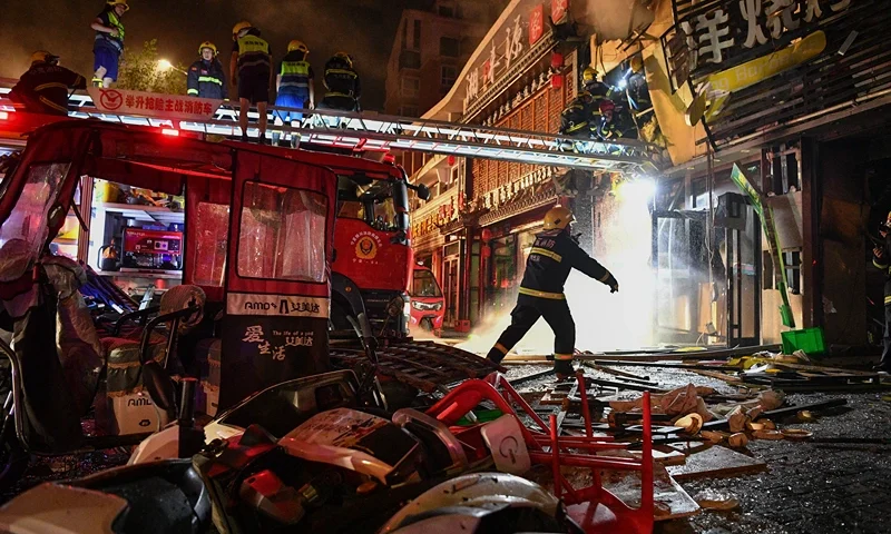 In this photo released by Xinhua News Agency, firefighters work at the site of an explosion at a restaurant in Yinchuan, northwest China's Ningxia Hui Autonomous Region, Wednesday, June 21, 2023. China's president Xi Jinping ordered a national safety campaign on Thursday after a massive cooking gas explosion at a barbecue restaurant in the northwest killed 31 people and injured seven others on the eve of a long holiday weekend. (Wang Peng/Xinhua via AP)