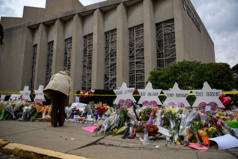 Mourners visit the memorial outside the Tree of Life Synagogue on October 31, 2018 in Pittsburgh, Pennsylvania. Eleven people were killed in a mass shooting at the Tree of Life Congregation in Pittsburgh's Squirrel Hill neighborhood on October 27. (Photo by Jeff Swensen/Getty Images)