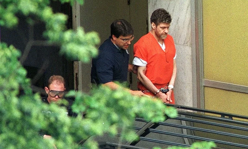 Convicted Unabomber Theodore Kaczynski is escorted by US Marshals outside the Sacramento County Federal Court, Sacramento, California, May 4, 1998. Kaczynski was given four consecutive life sentences. AFP PHOTO/POOL (Photo credit should read RICH PEDRONCELLI/AFP via Getty Images)